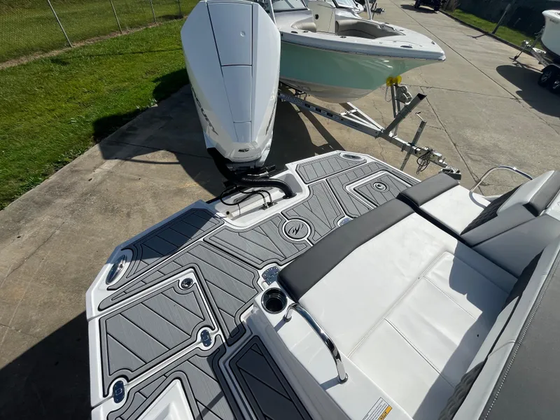 Slide: The Image of 2025 Monterey M-45 boat with sleek deck design and modern seating. - 5