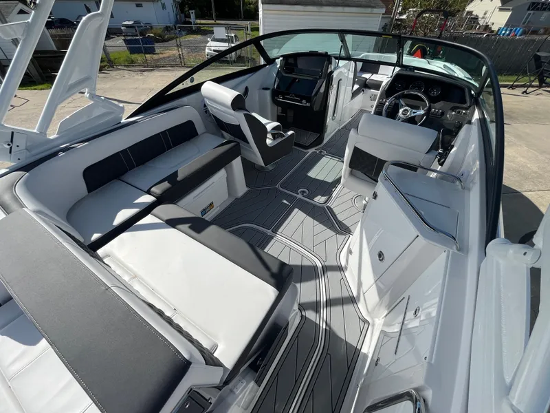 Slide: The Image of 2025 Monterey M-45 boat interior with sleek seating and modern dashboard design. - 8