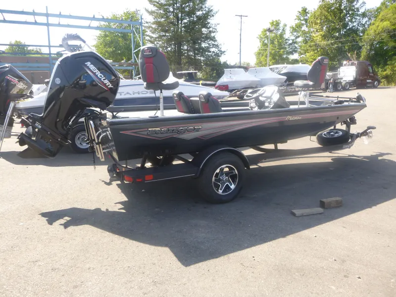 The Image of 2024 Ranger RT188C fishing boat with Mercury engine, parked outdoors. - 0