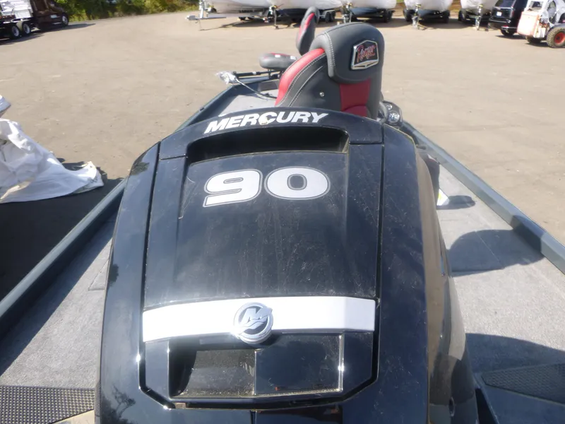 Slide: The Image of 2024 Ranger RT188C boat with Mercury 90 engine, outdoor setting. - 11