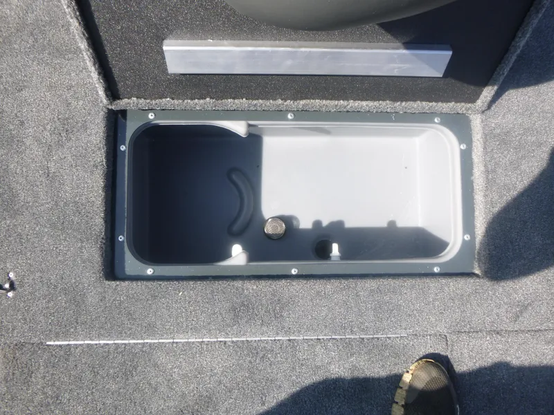 Slide: The Image of 2024 Ranger RT188C boat storage compartment with gray interior and carpeted flooring. - 24