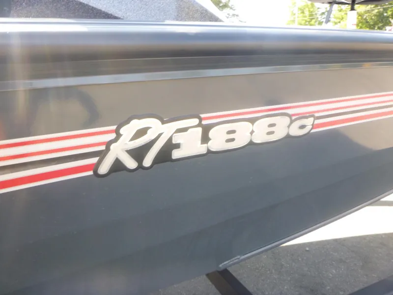 Slide: The Image of 2024 Ranger RT188C boat with red and white stripes on the side. - 3