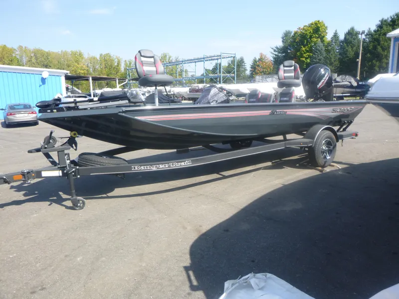 Slide: The Image of 2024 Ranger RT188C fishing boat on trailer in outdoor setting. - 8