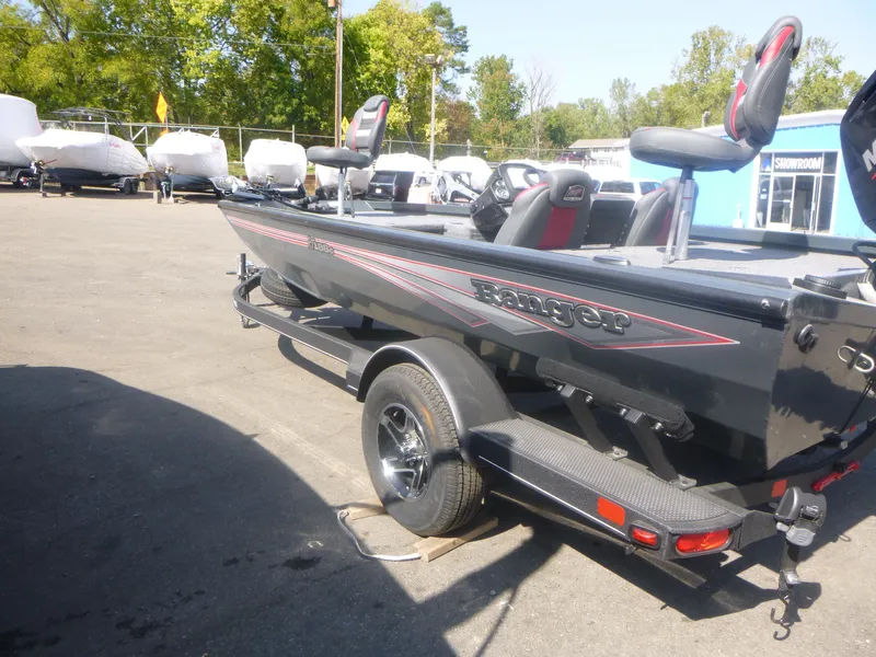 Slide: The Image of 2024 Ranger RT188C fishing boat on trailer in outdoor lot. - 9