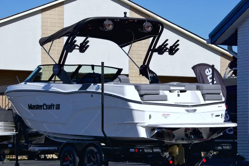 Slide: The Image of 2024 MasterCraft XT22T boat with sleek design and modern features. - 2