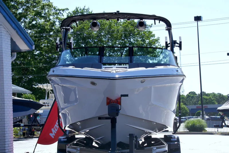 Slide: The Image of 2024 MasterCraft XT22T boat displayed outdoors, front view. - 5