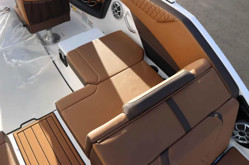 Slide: The Image of 2025 Yamaha Boats 222S interior with tan leather seating and modern design. - 10