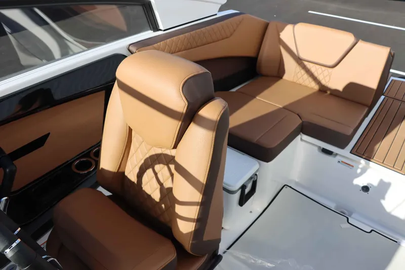 Slide: The Image of 2025 Yamaha Boats 222S interior with tan leather seating and modern design. - 13