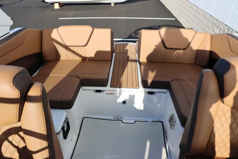 Slide: The Image of 2025 Yamaha Boats 222S interior with tan leather seating and modern design. - 14