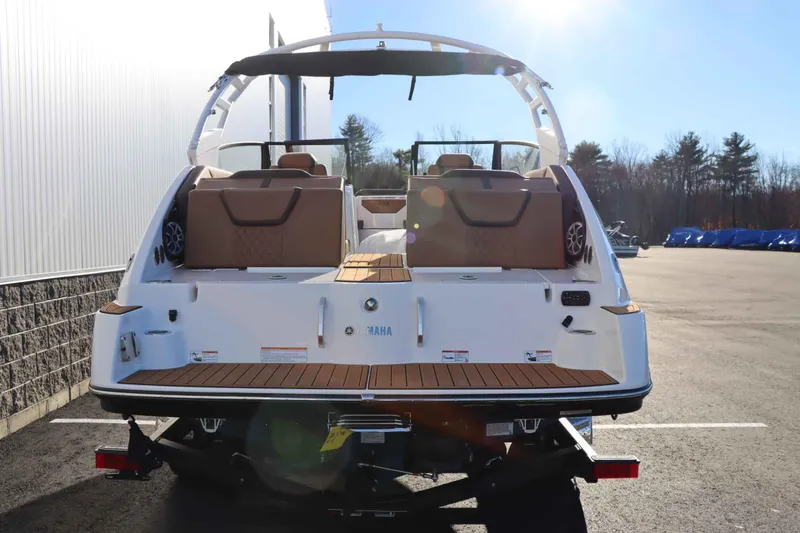 Slide: The Image of 2025 Yamaha Boats 222S, rear view, on trailer, sunny day. - 4