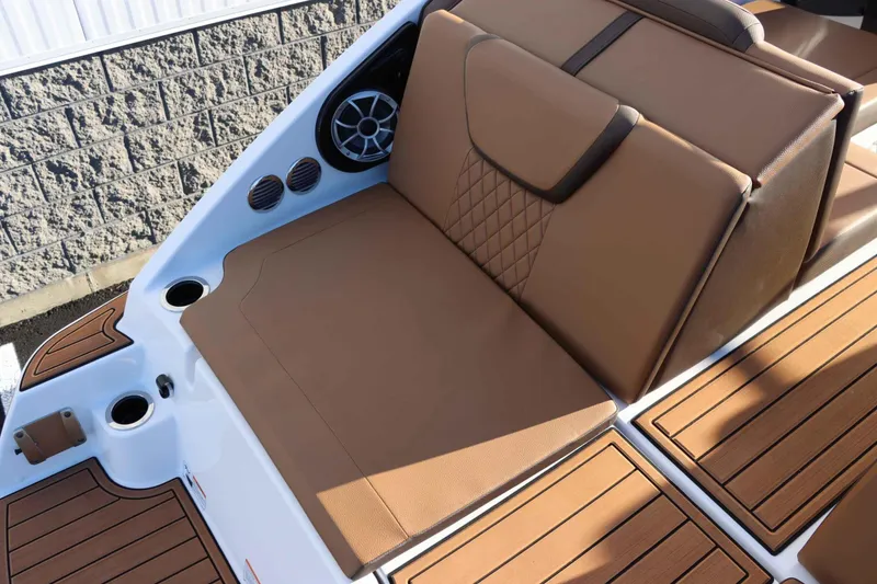 Slide: The Image of 2025 Yamaha Boats 222S interior with tan seating and modern design. - 7