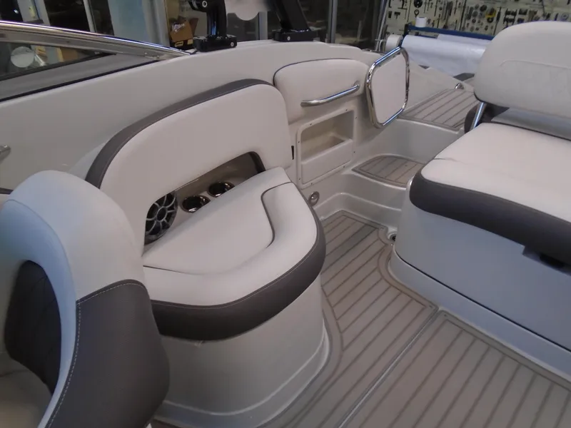 Slide: The Image of 2024 Crownline E 235 Surf boat interior with sleek seating and modern design. - 10