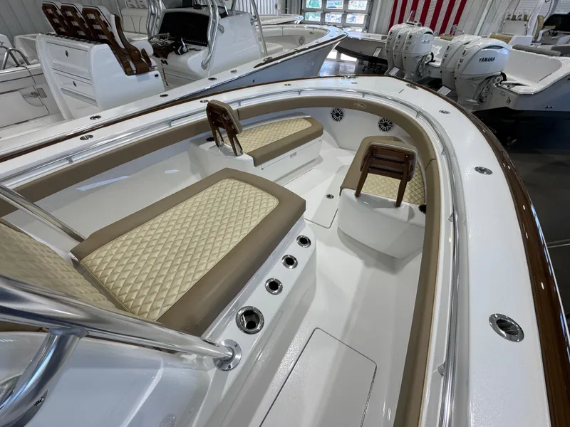 Slide: The Image of 2025 Valhalla Boatworks V-29 interior with cushioned seating and sleek design. - 11