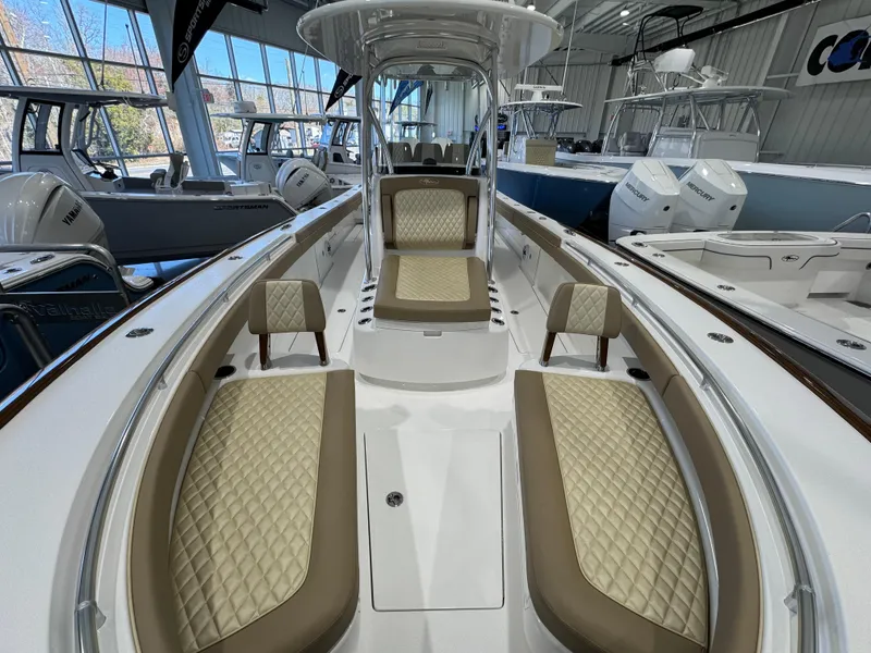 Slide: The Image of 2025 Valhalla Boatworks V-29 interior with luxurious seating in a showroom. - 13