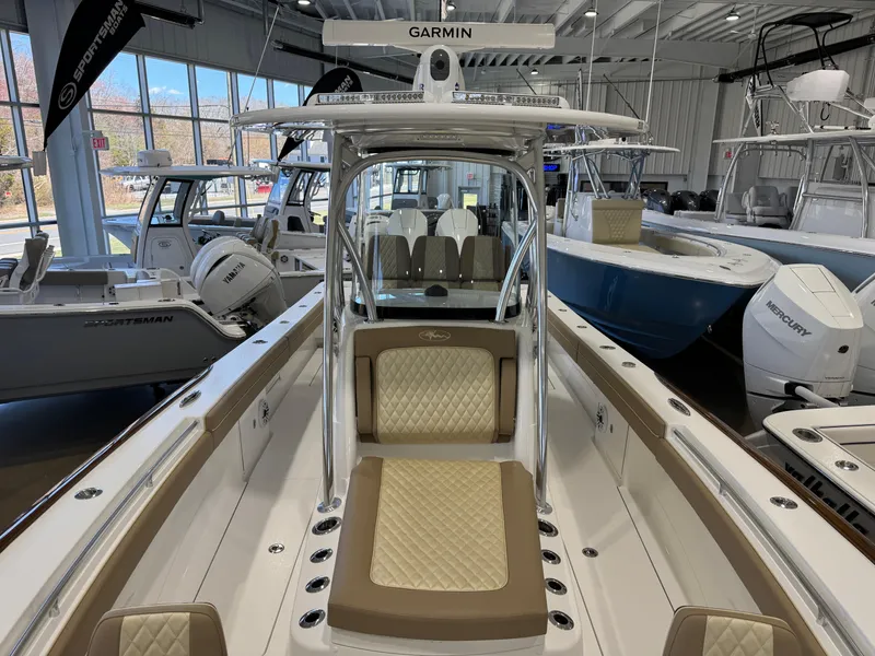 Slide: The Image of 2025 Valhalla Boatworks V-29 in showroom, featuring Garmin electronics and luxurious seating. - 14
