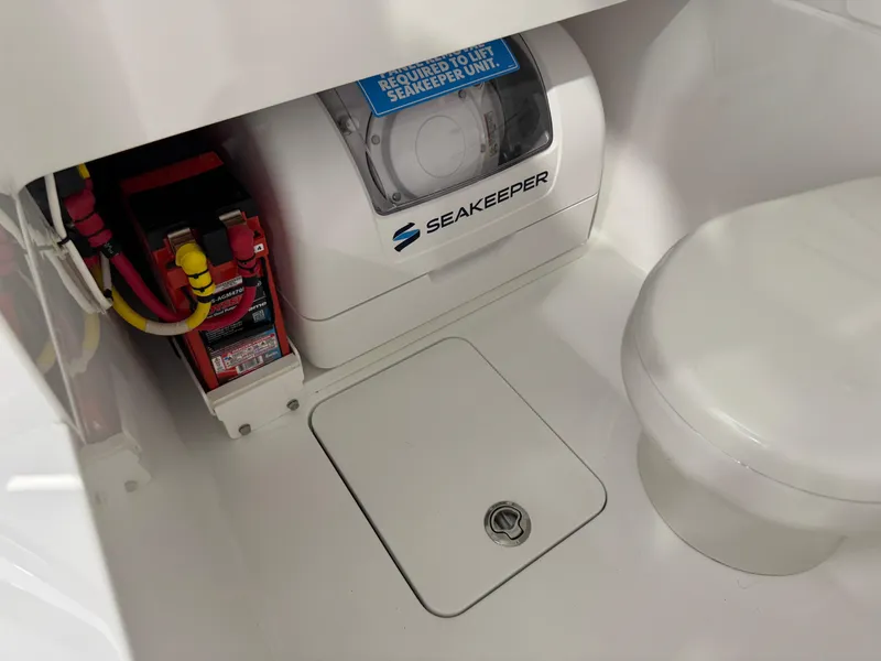 Slide: The Image of 2025 Valhalla Boatworks V-29 interior featuring Seakeeper unit and battery compartment. - 16