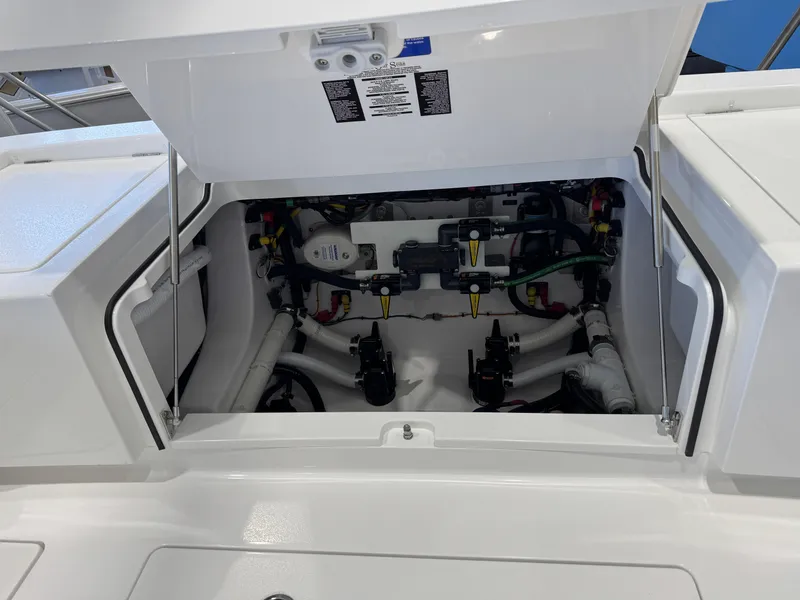 Slide: The Image of 2025 Valhalla Boatworks V-29 engine compartment with open hatch, showcasing internal components. - 18
