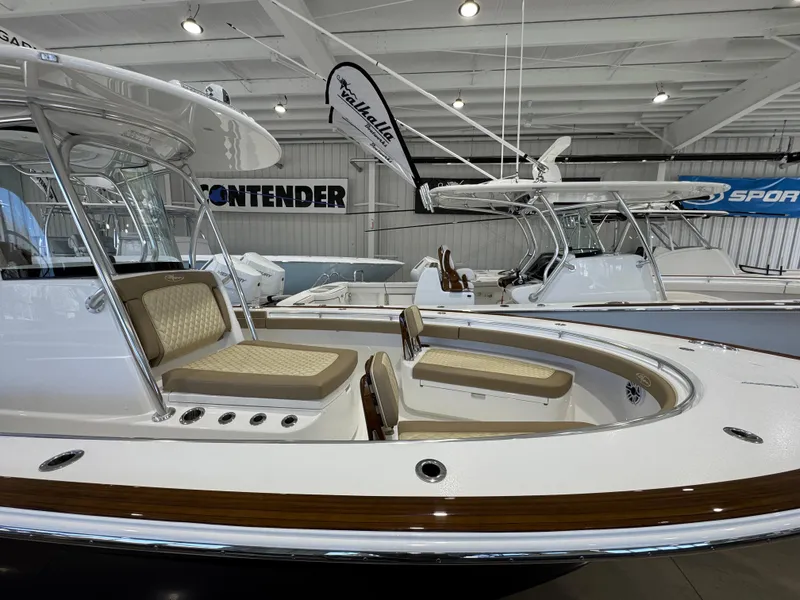 Slide: The Image of 2025 Valhalla Boatworks V-29 in showroom, featuring sleek design and comfortable seating. - 3