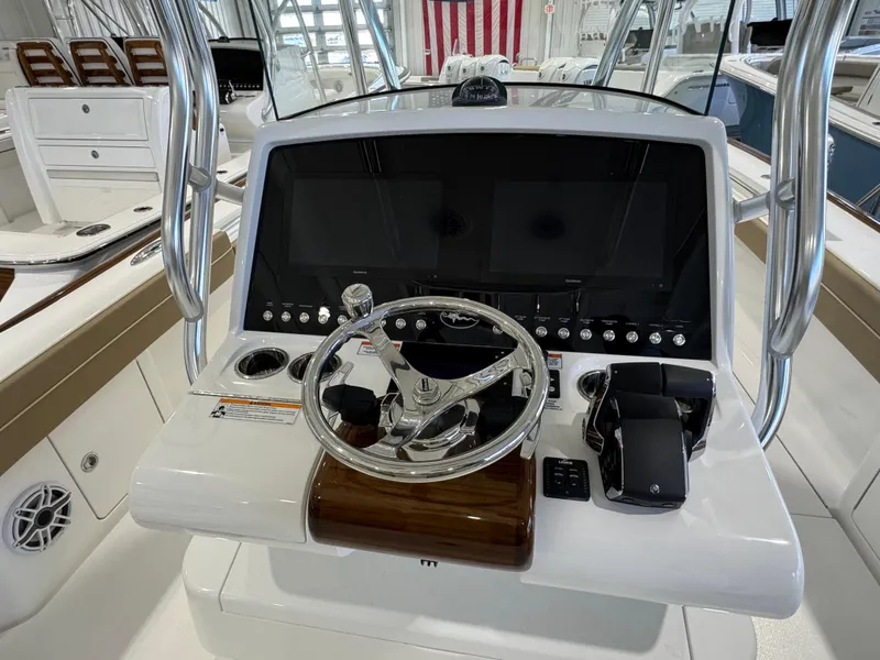 Slide: The Image of 2025 Valhalla Boatworks V-29 helm with modern controls and sleek design. - 7