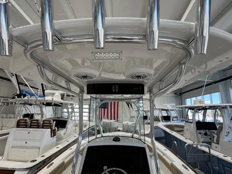 Slide: The Image of 2025 Valhalla Boatworks V-29 interior view in showroom with American flag. - 9