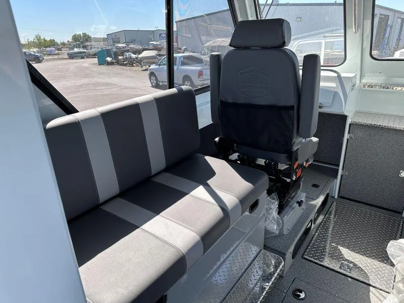 Slide: The Image of Interior of 2024 Hewescraft 270 Alaskan boat with seating and helm. - 4