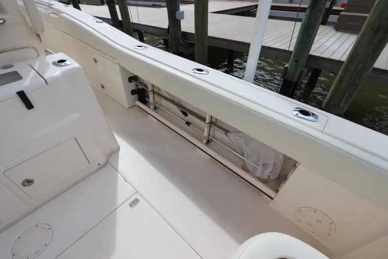 Slide: The Image of 2015 Grady-White Canyon 306 boat interior, featuring spacious deck and storage compartments. - 13