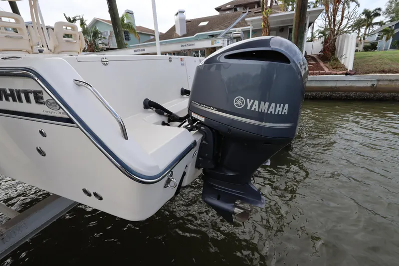 Slide: The Image of 2015 Grady-White Canyon 306 boat with Yamaha outboard motor in water. - 2