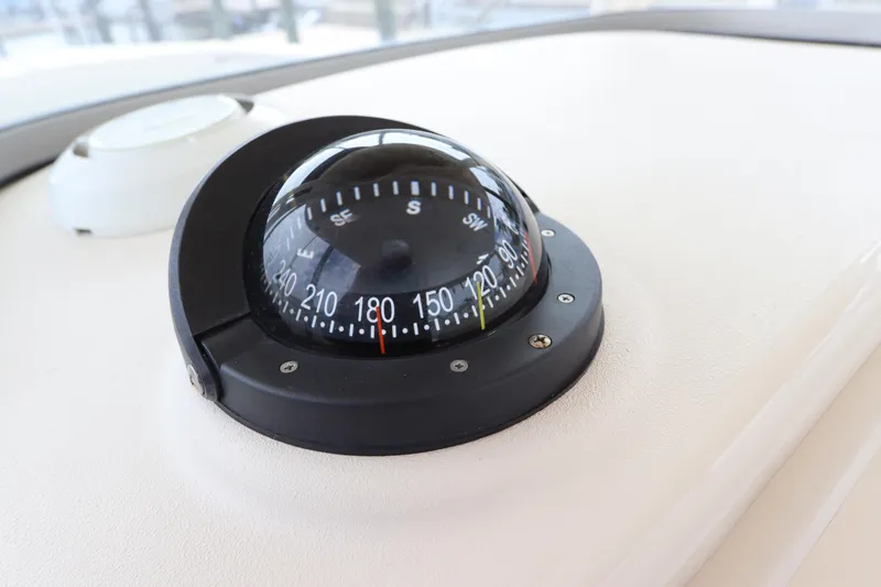 Slide: The Image of Compass on 2015 Grady-White Canyon 306 boat dashboard. - 20