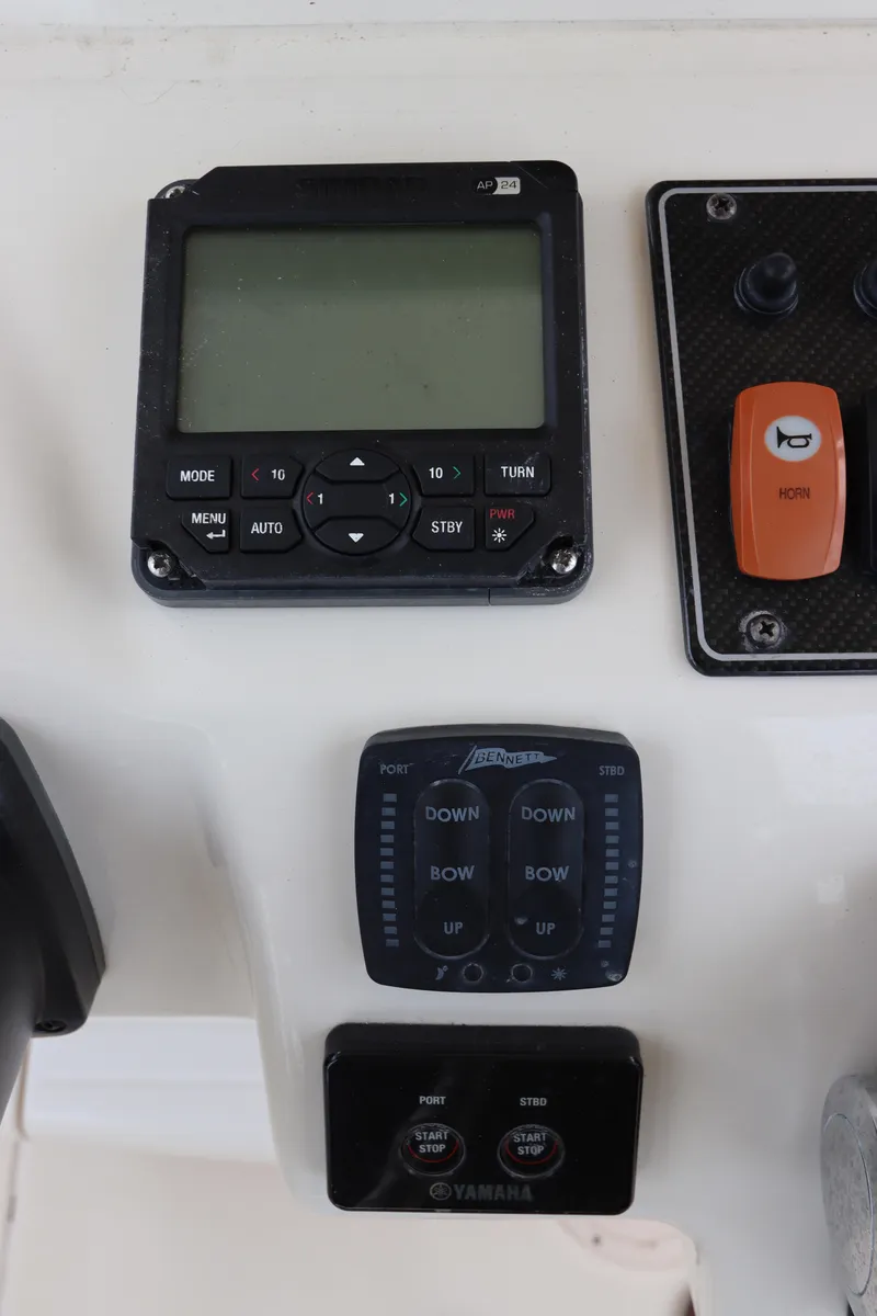 Slide: The Image of Control panel of a 2015 Grady-White Canyon 306 boat with electronic displays. - 21