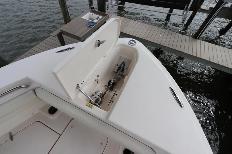 Slide: The Image of 2015 Grady-White Canyon 306 boat anchor compartment at dock. - 27
