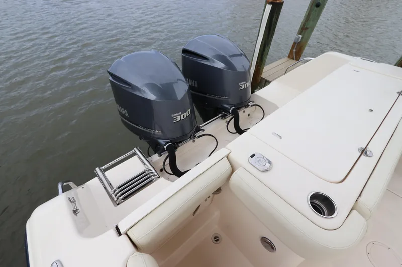 Slide: The Image of 2015 Grady-White Canyon 306 boat with twin 300 horsepower engines docked. - 4