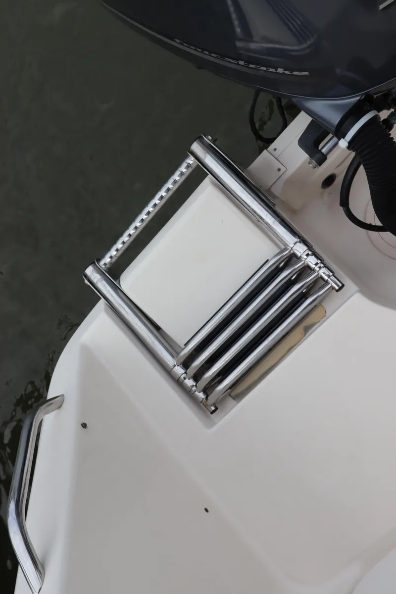 Slide: The Image of 2015 Grady-White Canyon 306 boat with stainless steel swim ladder. - 5