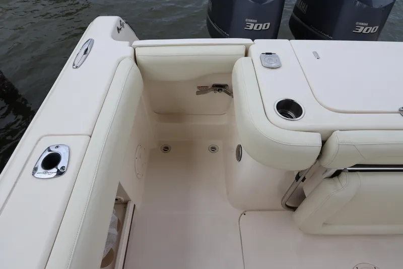 Slide: The Image of 2015 Grady-White Canyon 306 boat interior with seating and engine view. - 6