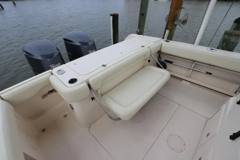 Slide: The Image of 2015 Grady-White Canyon 306 boat with dual engines and spacious seating area. - 8