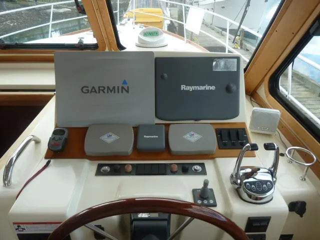 Slide: The Image of Helm of 2006 Sabre 38 Express with Garmin and Raymarine navigation systems. - 15