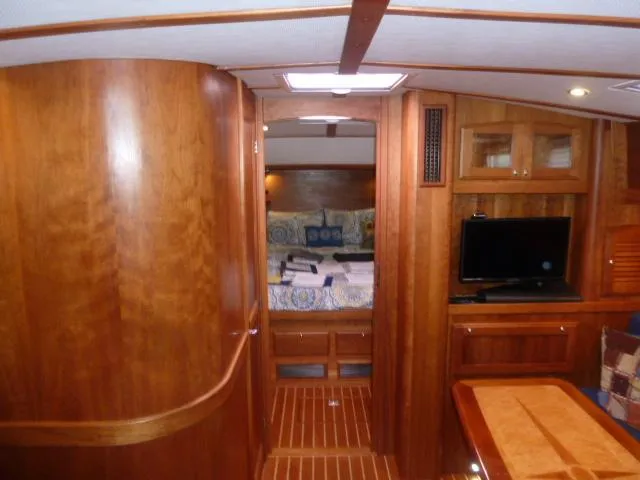 Slide: The Image of 2006 Sabre 38 Express yacht interior with wood finish, cozy cabin, and modern amenities. - 22