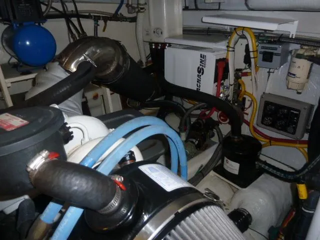 Slide: The Image of Engine room of 2006 Sabre 38 Express boat with various mechanical components. - 28