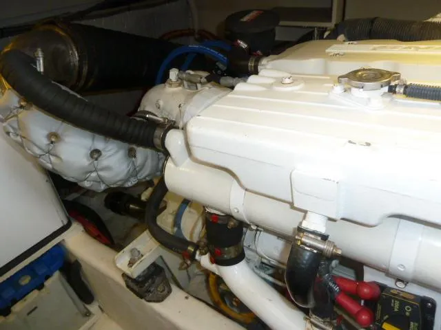 Slide: The Image of Engine compartment of a 2006 Sabre 38 Express boat, showcasing mechanical components. - 32