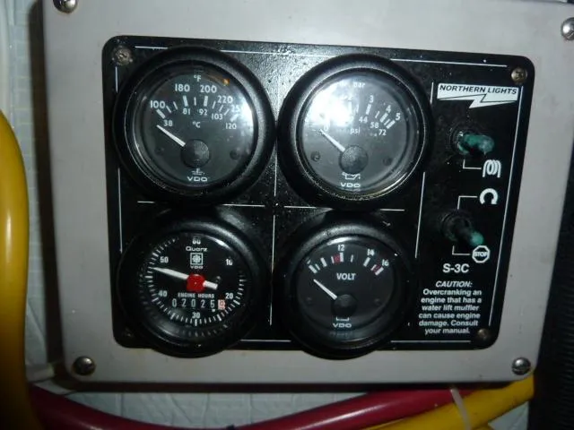 Slide: The Image of Control panel with gauges on a 2006 Sabre 38 Express boat. - 36