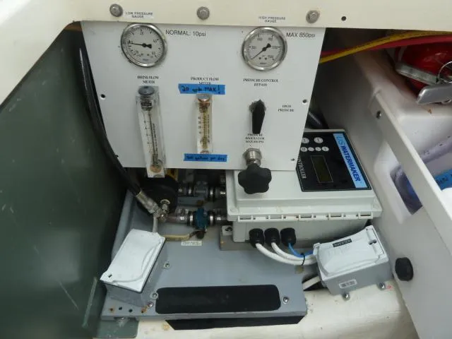 Slide: The Image of Control panel of a 2006 Sabre 38 Express boat with gauges and switches. - 38