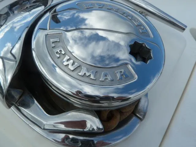 Slide: The Image of Chrome Lewmar winch on 2006 Sabre 38 Express, reflecting sky and clouds. - 41
