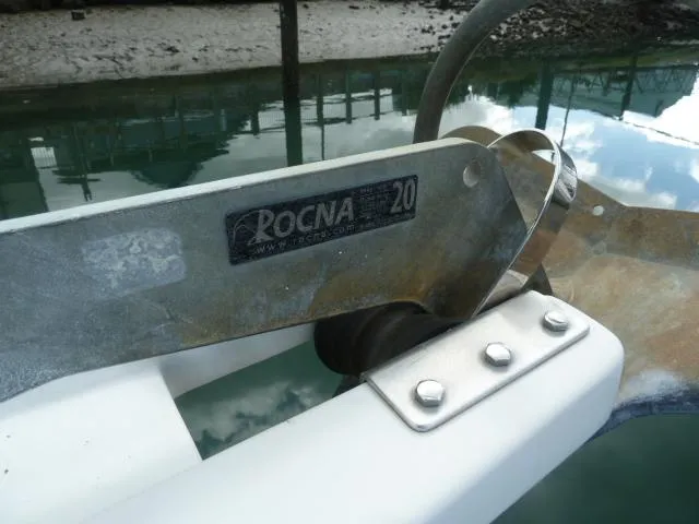 Slide: The Image of Rocna anchor on 2006 Sabre 38 Express boat, docked by the water. - 42