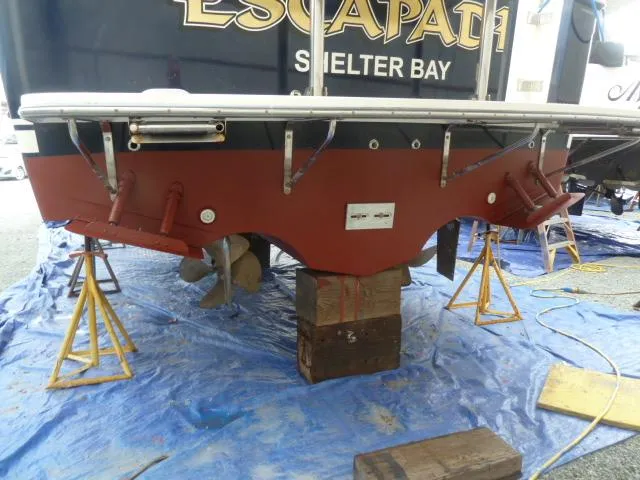 Slide: The Image of 2006 Sabre 38 Express boat on stands, undergoing maintenance at Shelter Bay. - 49