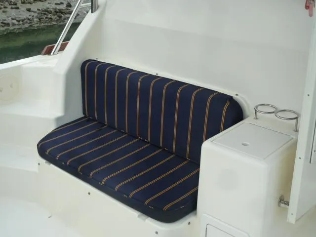 Slide: The Image of Navy-striped seating on 2006 Sabre 38 Express boat deck. - 8