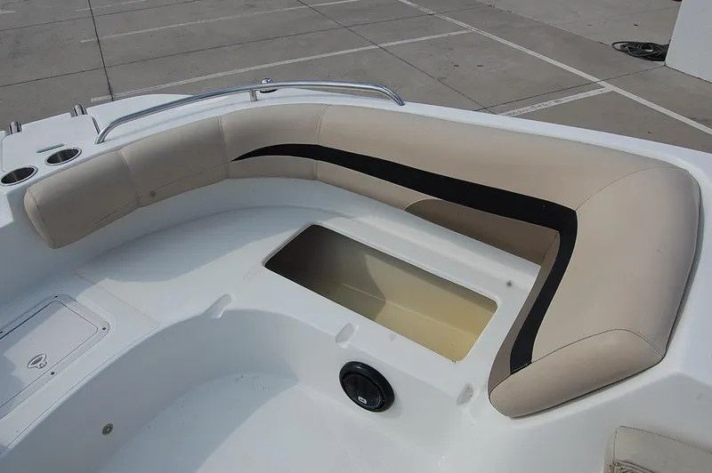 Slide: The Image of 2019 Hurricane SunDeck Sport 188 OB boat seating area with storage compartment. - 7
