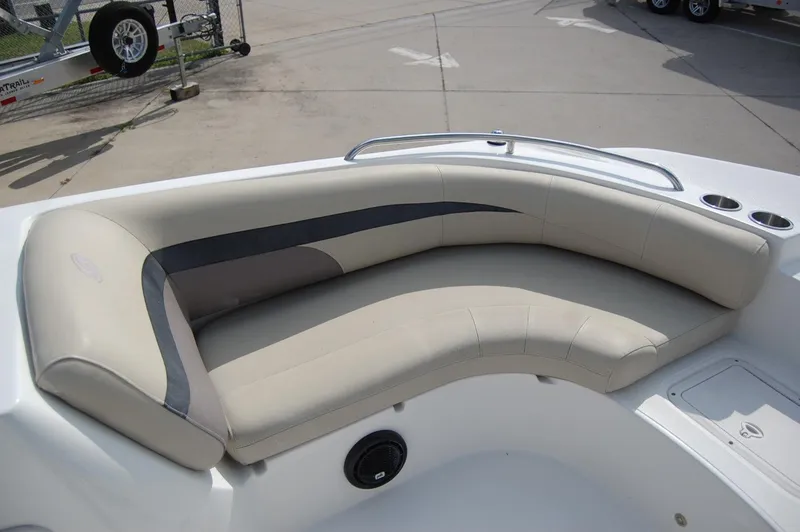 Slide: The Image of 2019 Hurricane SunDeck Sport 188 OB boat interior with beige seating and cup holders. - 8