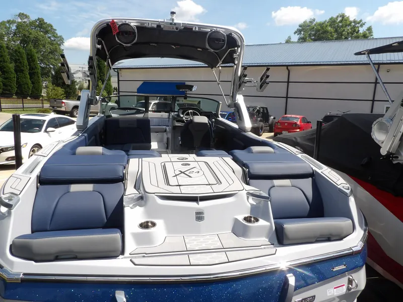 Slide: The Image of 2024 MasterCraft X24 boat with spacious seating and sleek design. - 12