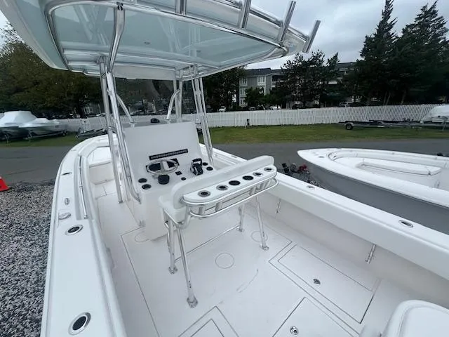 Slide: The Image of 2024 Contender 28 Tournament boat interior with rod holders and console. - 2