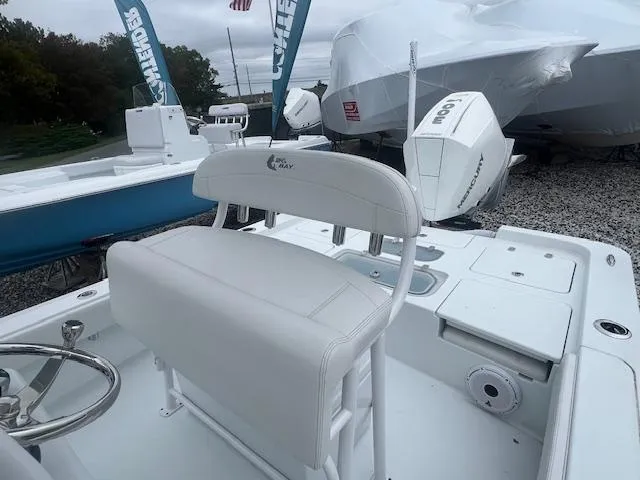 Slide: The Image of 2024 Contender 26 Bay boat with white seating and modern design. - 4