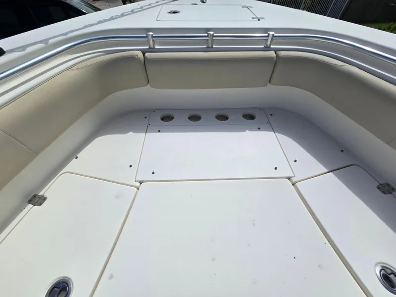 Slide: The Image of 2015 Cobia 296 Center Console boat with spacious seating and storage area. - 38